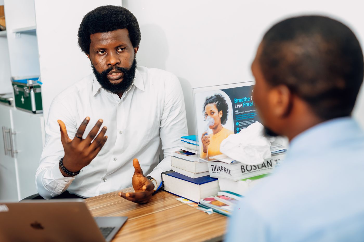 Black healthcare professional discussing health needs with a customer